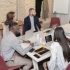 a group of young multiethnic business people have a business meeting in a boardroom working on the project