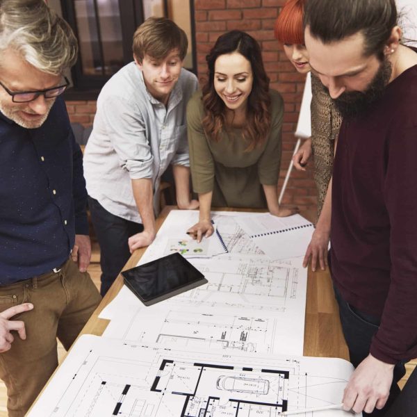 Business team working on the sketch of new house